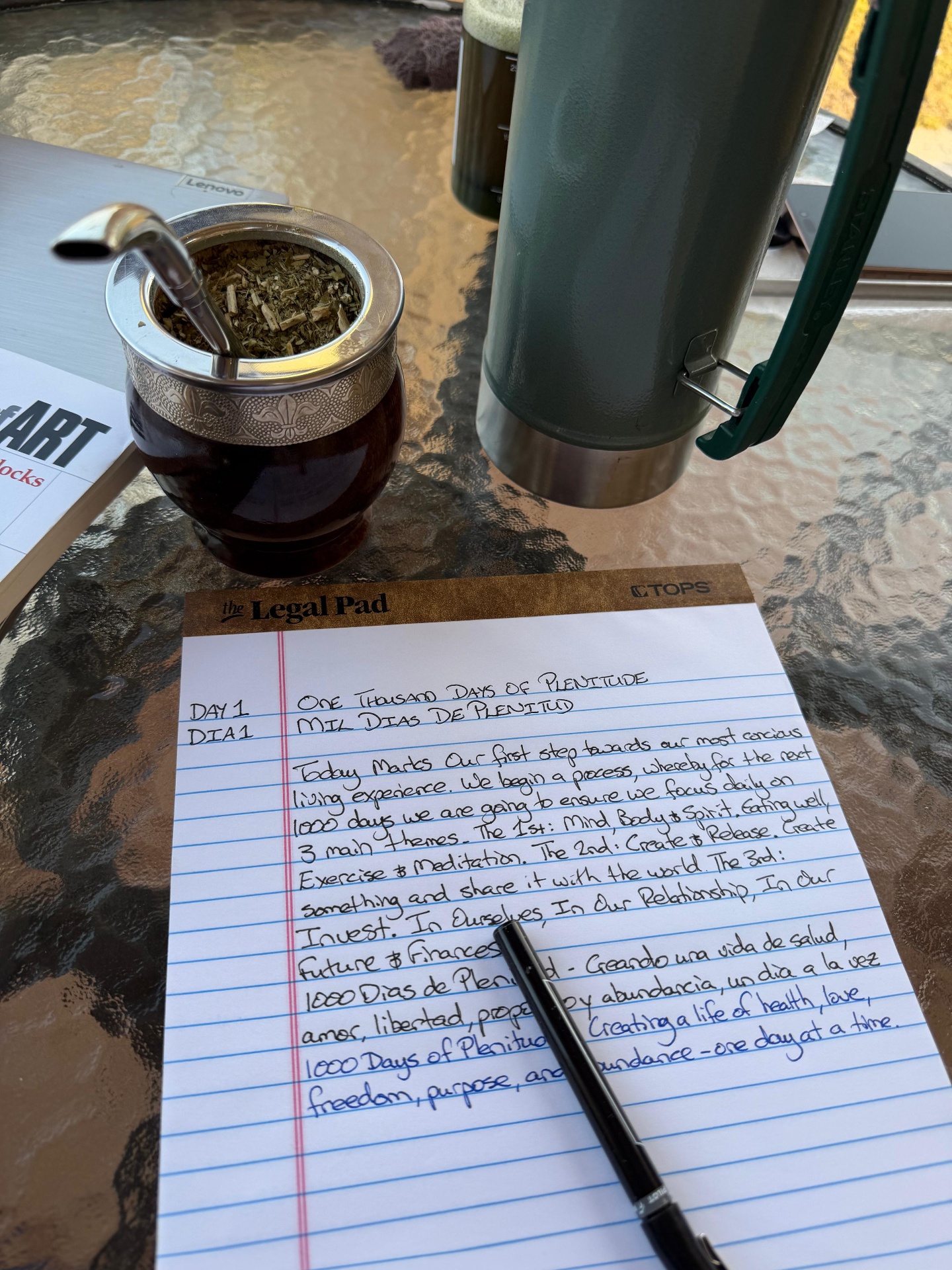 Day One journal entry beside a yerba mate gourd at sunrise in Grand Turk.